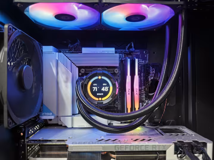 Open PC case showing an AIO radiator, RGB fans and clean cable routing for airflow